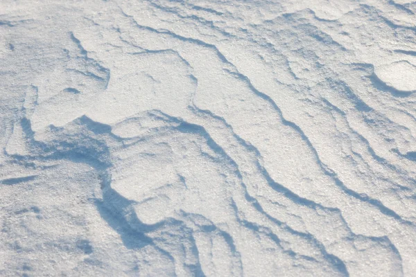 Textura da cobertura de neve na praia em um dia ensolarado — Fotografia de Stock