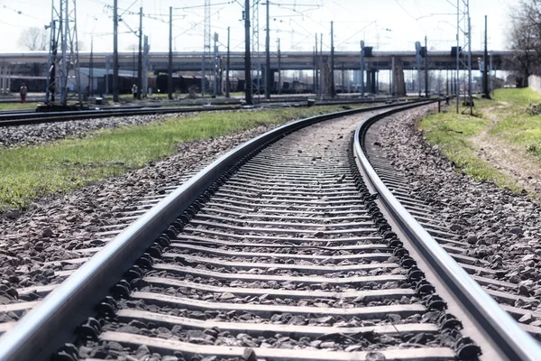 Railroad tracks and a mound of stones — Stock Photo, Image