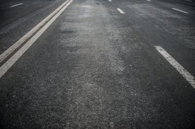 Asphalt road with white stripes clipart