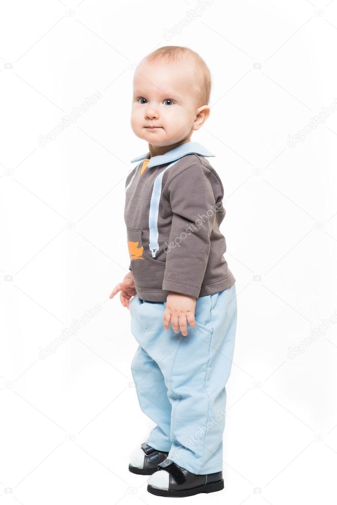 Cute baby boy standing isolated on white backgroung
