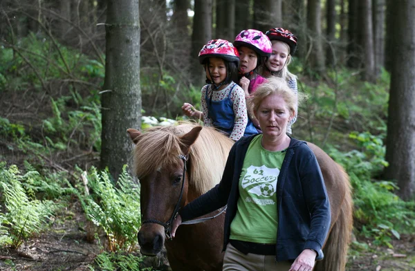 Girls on the horse riding — Stock Photo, Image