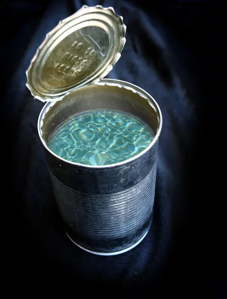 Metal can with water — Stock Photo, Image