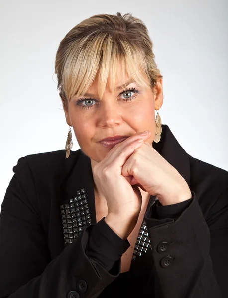 Studio portrait of a cute blond girl looking in front of her — Stock Photo, Image