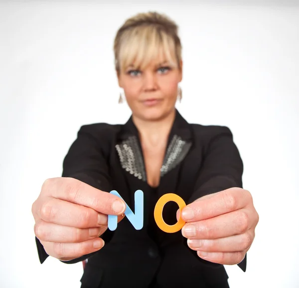 Studio portrait of a cute blond girl holding two letters forming — Stock Photo, Image