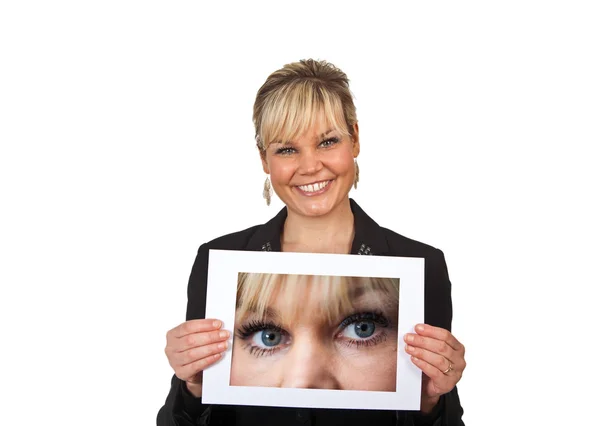 Studio portrait of a cute blond girl holding a piece of paper — Stock Photo, Image