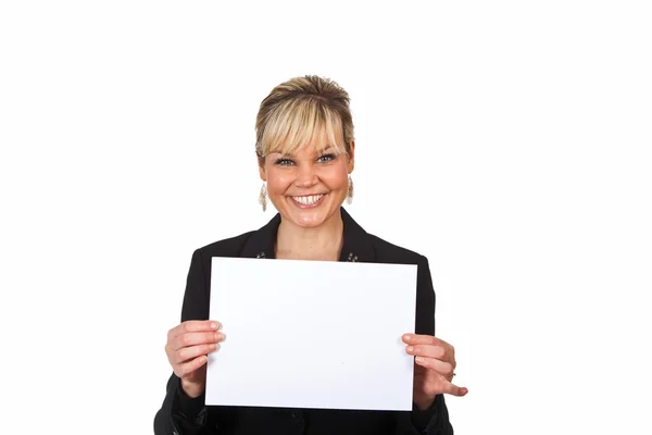 Studio portrait of a cute blond girl holding a piece of paper Royalty Free Stock Images