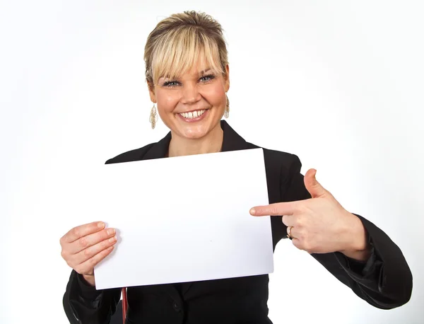 Studio portrait of a cute blond girl holding a piece of paper Stock Image