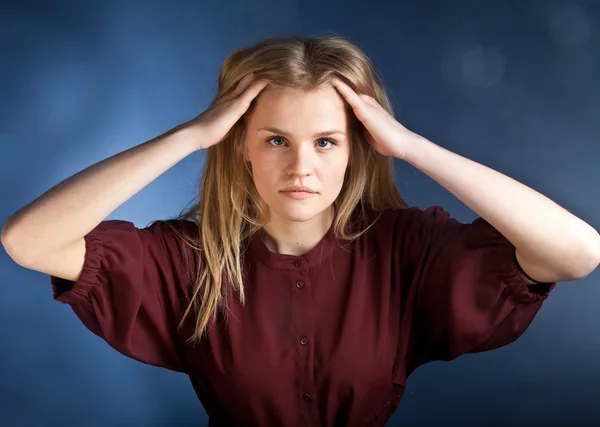 Scandinavian cute young girl with hands on head — Stock Photo, Image