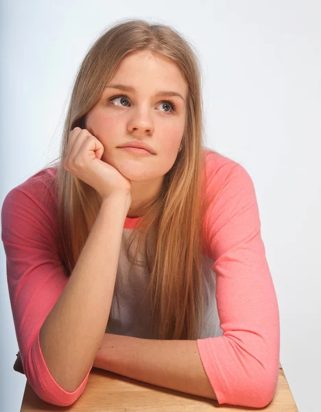 Scandinavian cute young girl portrait with head in one hand look — Stock Photo, Image