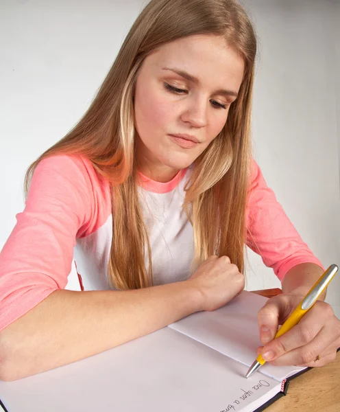 Scandinavian cute young girl writting — Stock Photo, Image