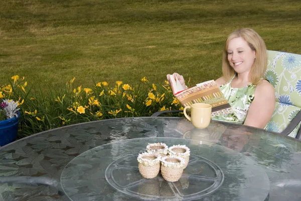 Woman on Patio with Coffee and Book