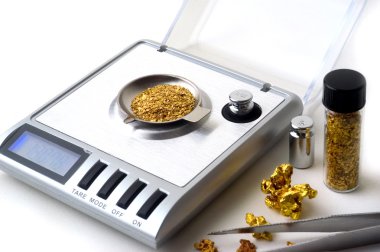 Weighing of gold clipart