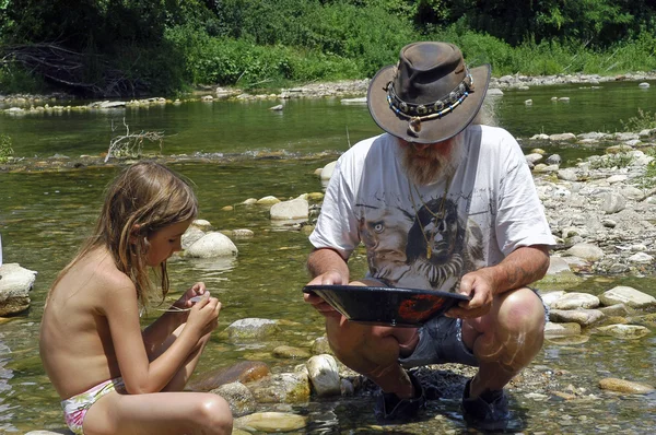 Lesson of gold washing in river — Stock Photo, Image