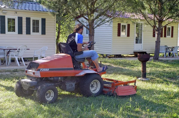 To mow the lawn with the camp-site before the season — Stock Photo, Image