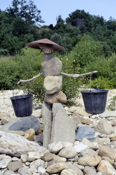 Gold washer made of stones in balance — Stock Photo, Image