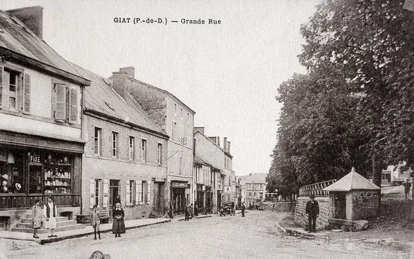 Old postcard of Giat, high street — Stock Photo, Image