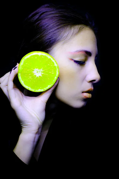 Young beautiful woman and orange portrait — Stock Photo, Image