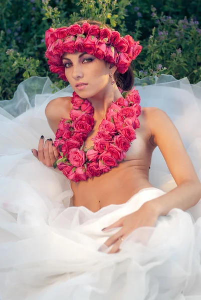 Young beautiful model with rose crown — Stock Photo, Image