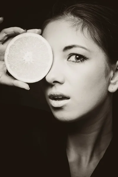 Young beautiful woman and orange portrait — Stock Photo, Image