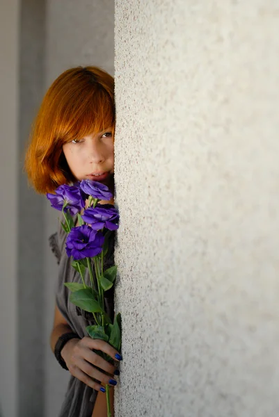 Young beautiful red hair woman holding purple chinese rose copy — Stock Photo, Image