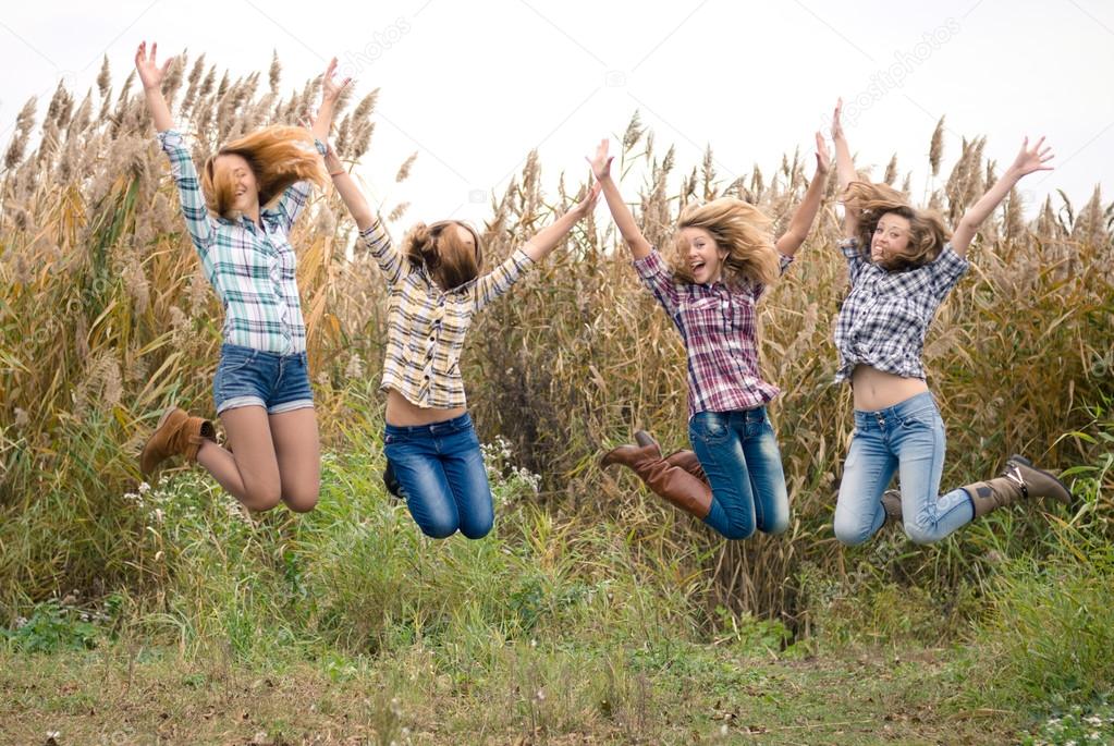 Four happy teenage friends