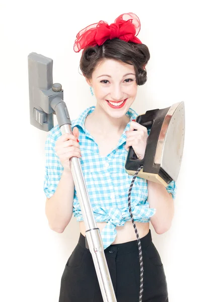 Beautiful young house wife with iron & vacuum cleaner on white — Stock Photo, Image