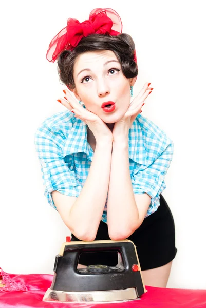 Beautiful young surprised house wife with iron on white — Stock Photo, Image