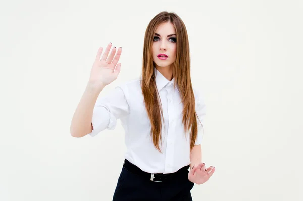 Junge Geschäftsfrau berührt virtuellen Bildschirm auf Weiß — Stockfoto