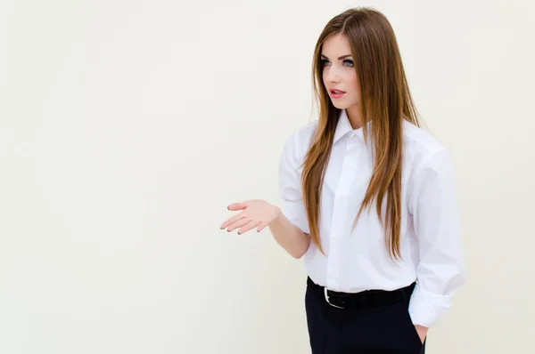 Young business woman wearing man's shirt presenting copyspace — Stock Photo, Image