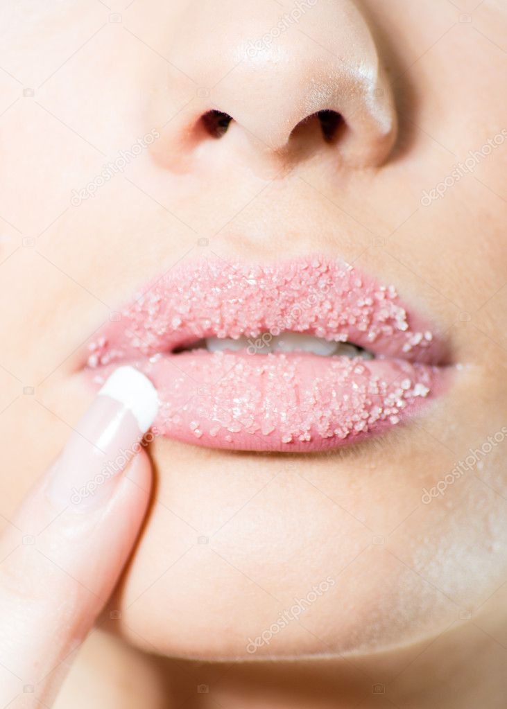 Closeup on female sweet candy sugar lips kiss