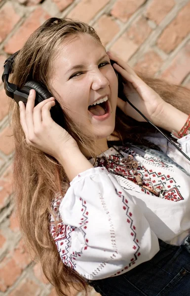 Teenager girl in headphones — Stock Photo, Image