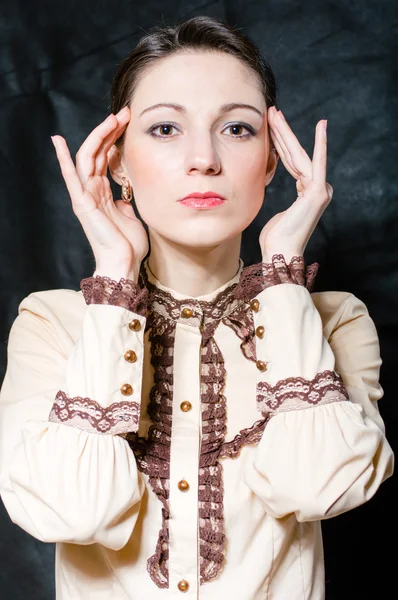 Young business woman touching head in pain or stress — Stock Photo, Image