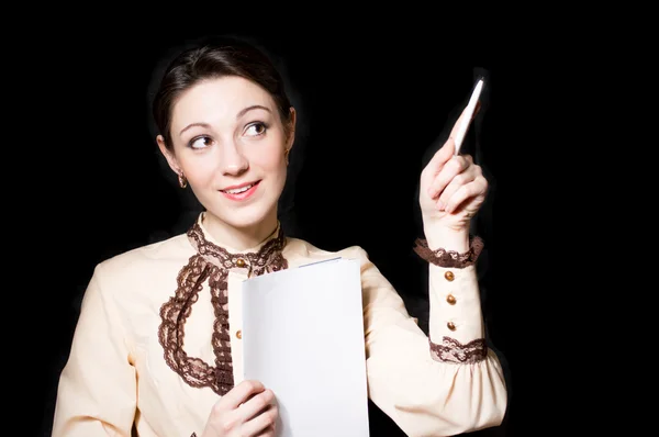 Young happy female teacher or business woman showing on board — Stock Photo, Image