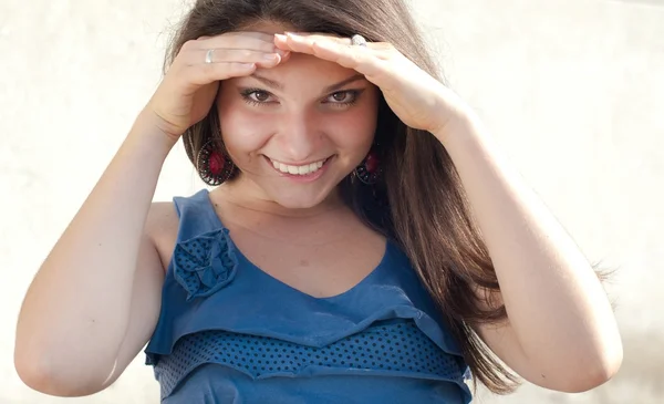 Happy young confident woman in blue blouse searching — Stock Photo, Image
