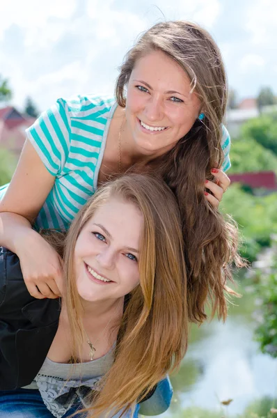 Two Teen Girl Friends Laughing in spring or summer outdoors — Stock Photo, Image