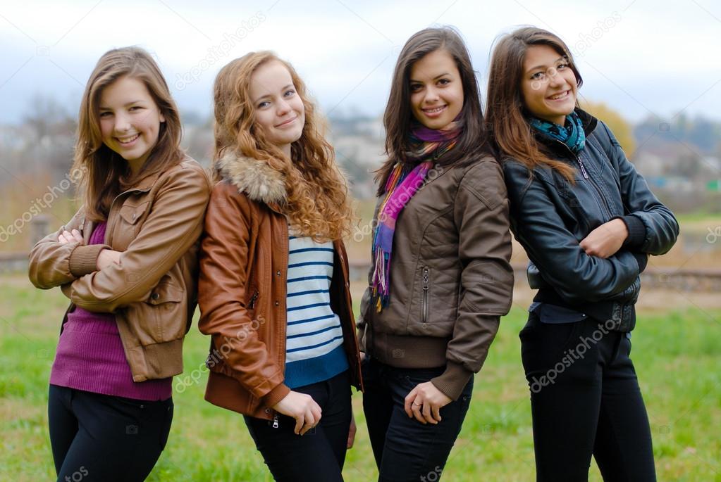 Four happy teenage friends