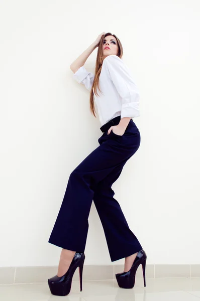 Fashion young business woman wearing man's shirt on white — Stock Photo, Image