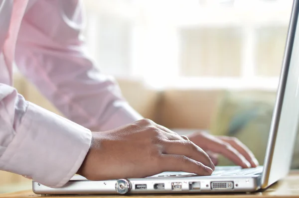 Businessman hands on laptop keyboard typing — Stock Photo, Image