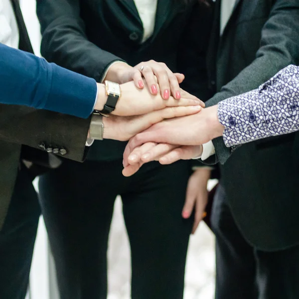 Group of business people with hands together — Stock Photo, Image