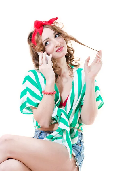 Funny pinup woman speaking on mobile — Stock Photo, Image