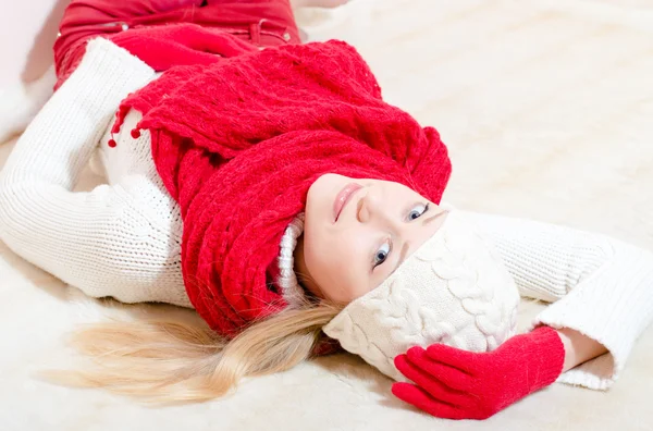 Pretty happy woman wearing red knitted scarf and gloves — Stock Photo, Image