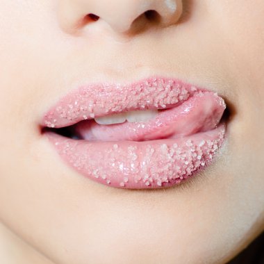 Woman licking lips in sugar clipart