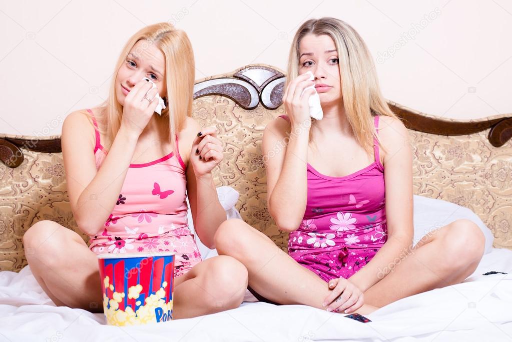 Women  with popcorn, watching movie and crying