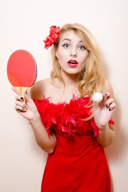 Woman with flower in hair and bat ball for table tennis clipart