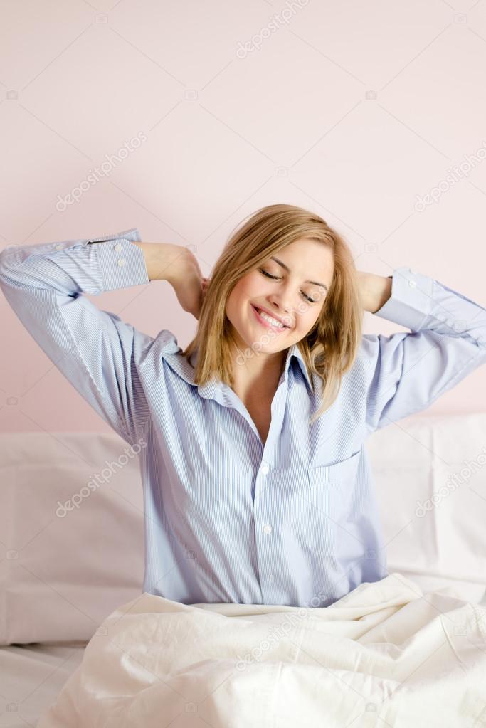 Woman  stretching in bed