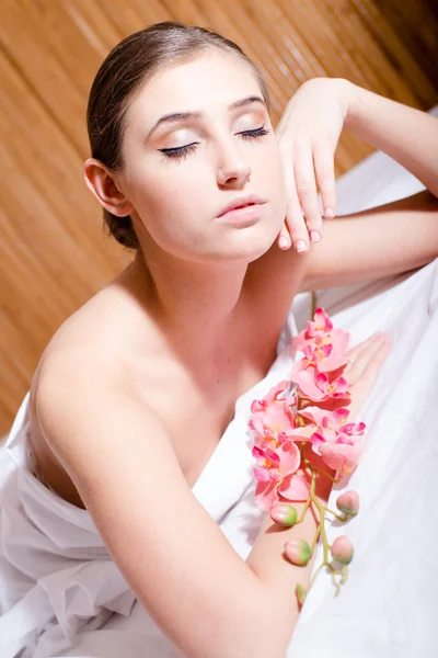 Brunette lying in the spa salon — Stock Photo, Image