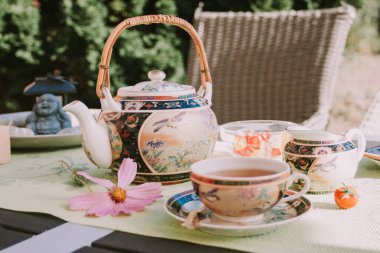 Tea party in chinese style in the summer garden