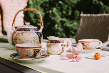 Tea party in chinese style in the summer garden