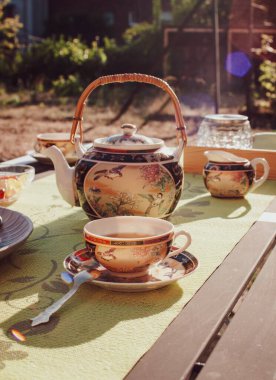 Tea party in chinese style in the summer garden