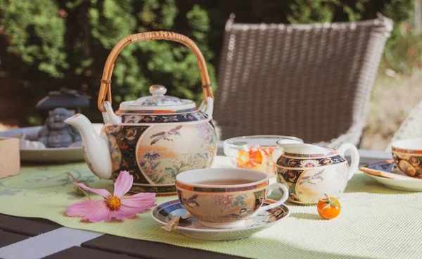 Tea party in chinese style in the summer garden